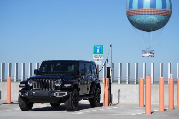 black jeep using a novaCHARGE charger in parking lot.