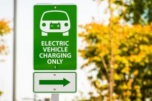 Green sign that reads Electric Vehicle Charging Only 242573541