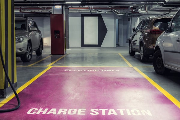 Parking deck EV charging station and designated parking spot 270680705
