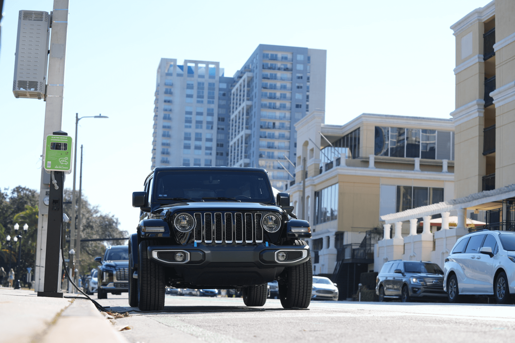 black jeep using a novaCHARGE charger in side street
